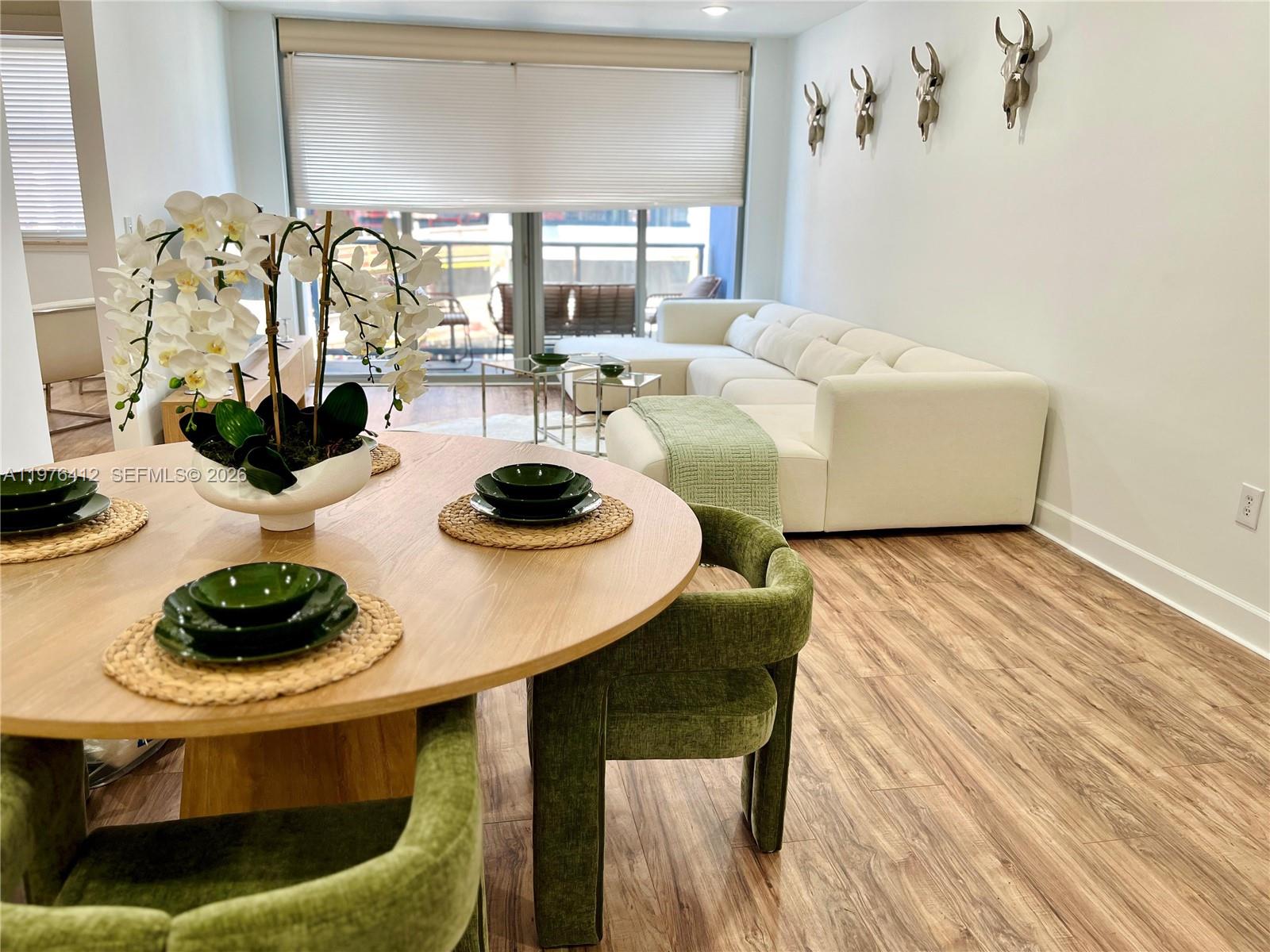 401 69th Street, Unit 405 Miami Beach, FL 33141 - Photo 2 of 20 a living room with furniture and decor