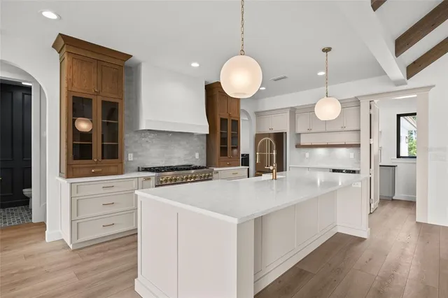 a view of a room with wooden floor staircase and windows