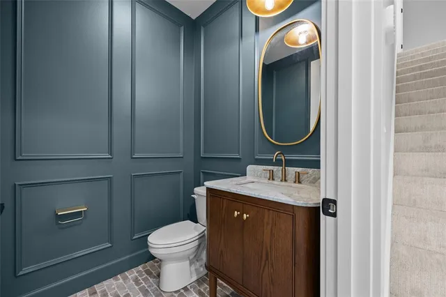 an empty room with a window and a ceiling fan