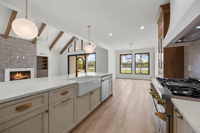 a view of a kitchen with furniture and chandelier