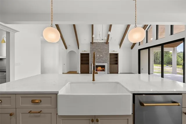 a kitchen with a stove and a refrigerator