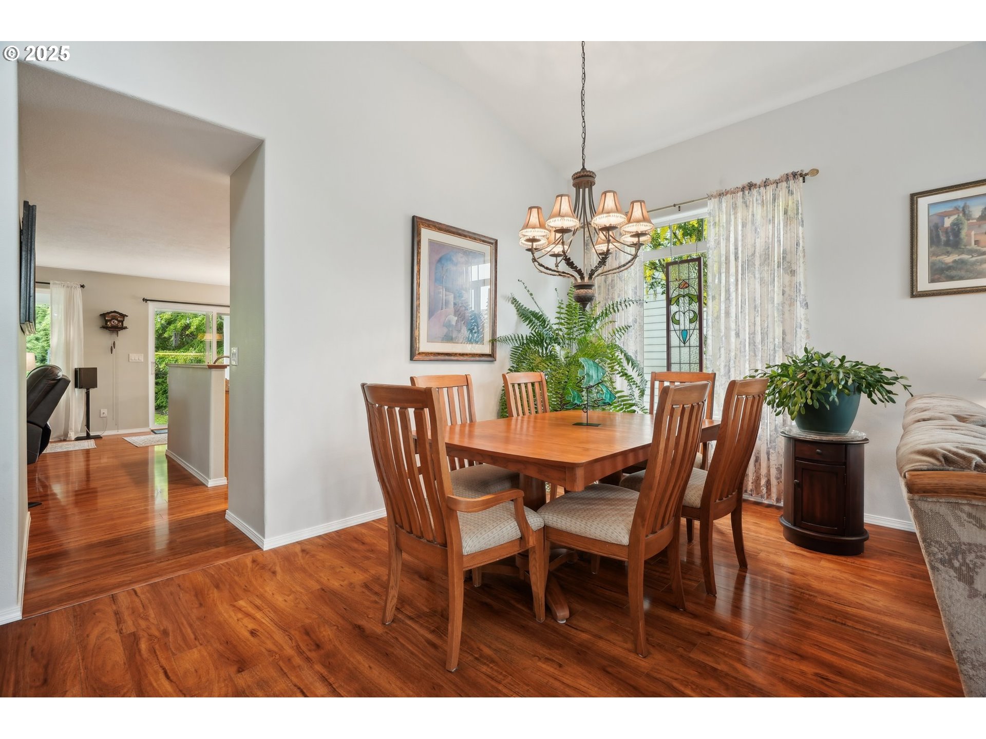4709 Southeast Antelope Hills Gresham, OR 97080 - Photo 11 of 48 a dining room with furniture potted plants and wooden floor