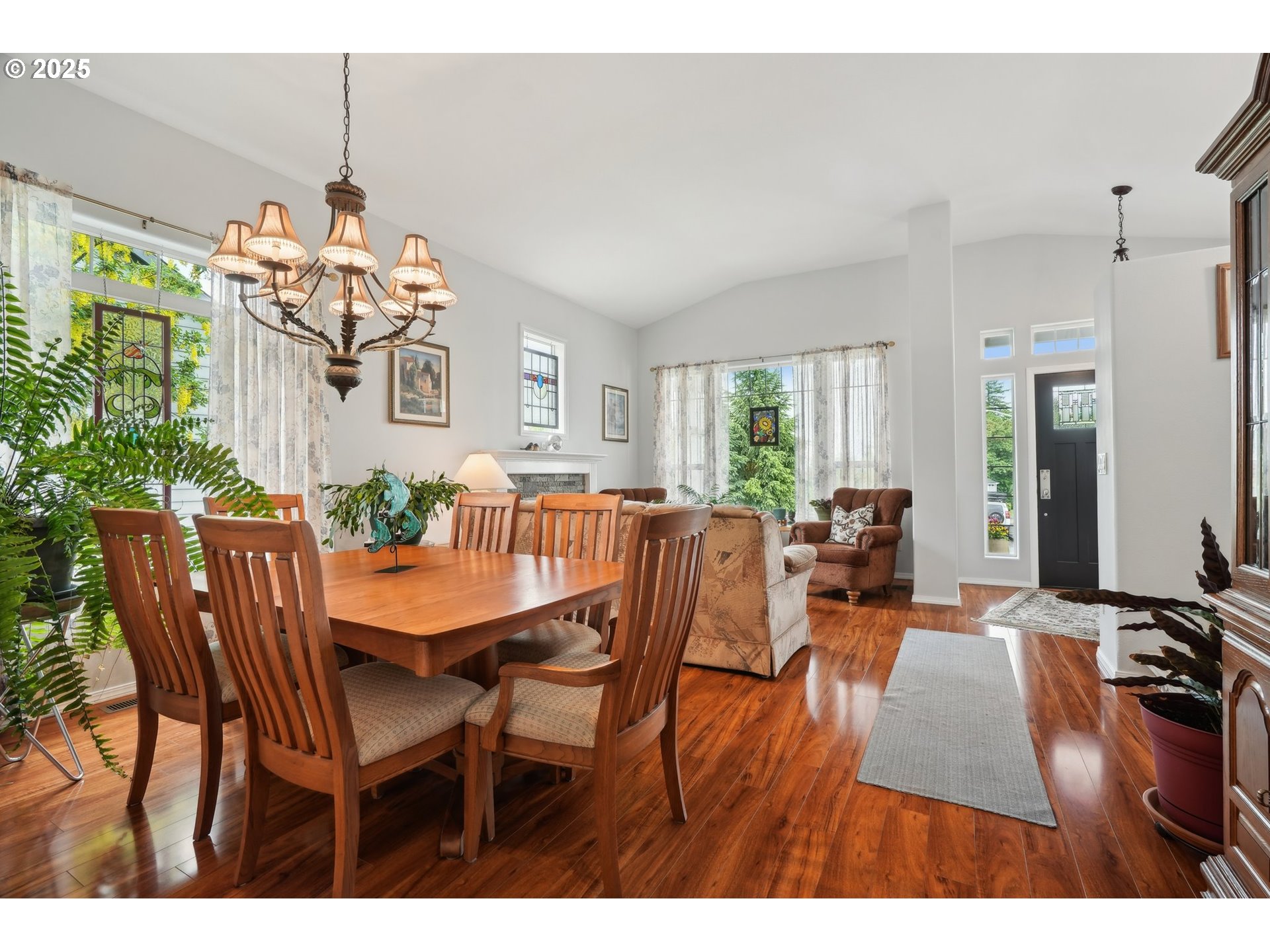 4709 Southeast Antelope Hills Gresham, OR 97080 - Photo 12 of 48 a view of a dining room with furniture a livingroom and chandelier