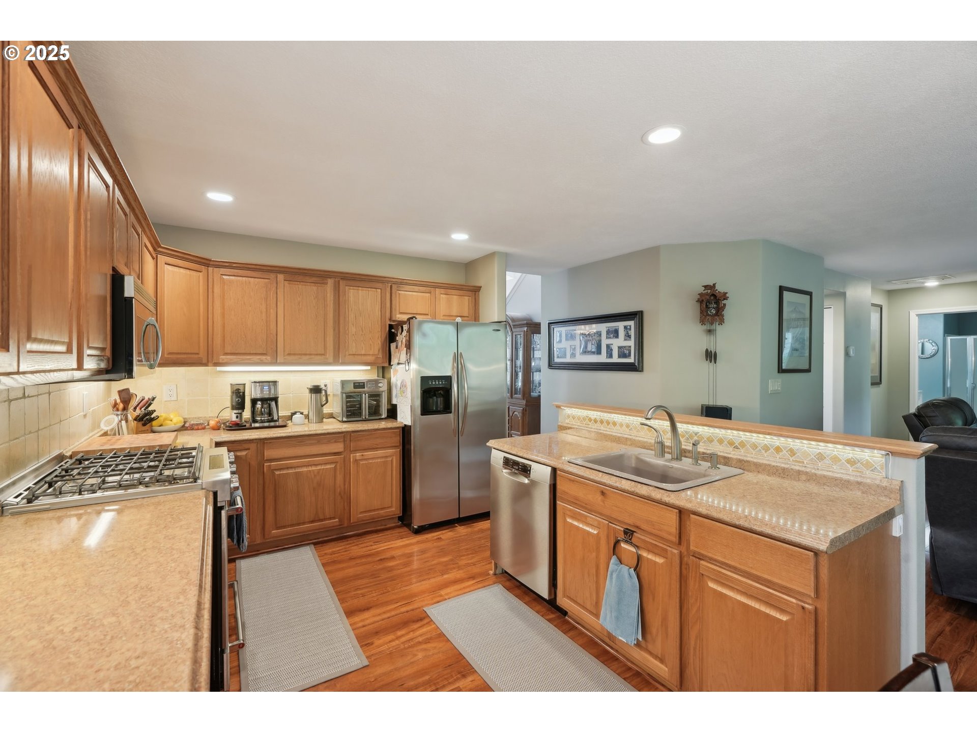 4709 Southeast Antelope Hills Gresham, OR 97080 - Photo 17 of 48 a kitchen with a sink stove and refrigerator