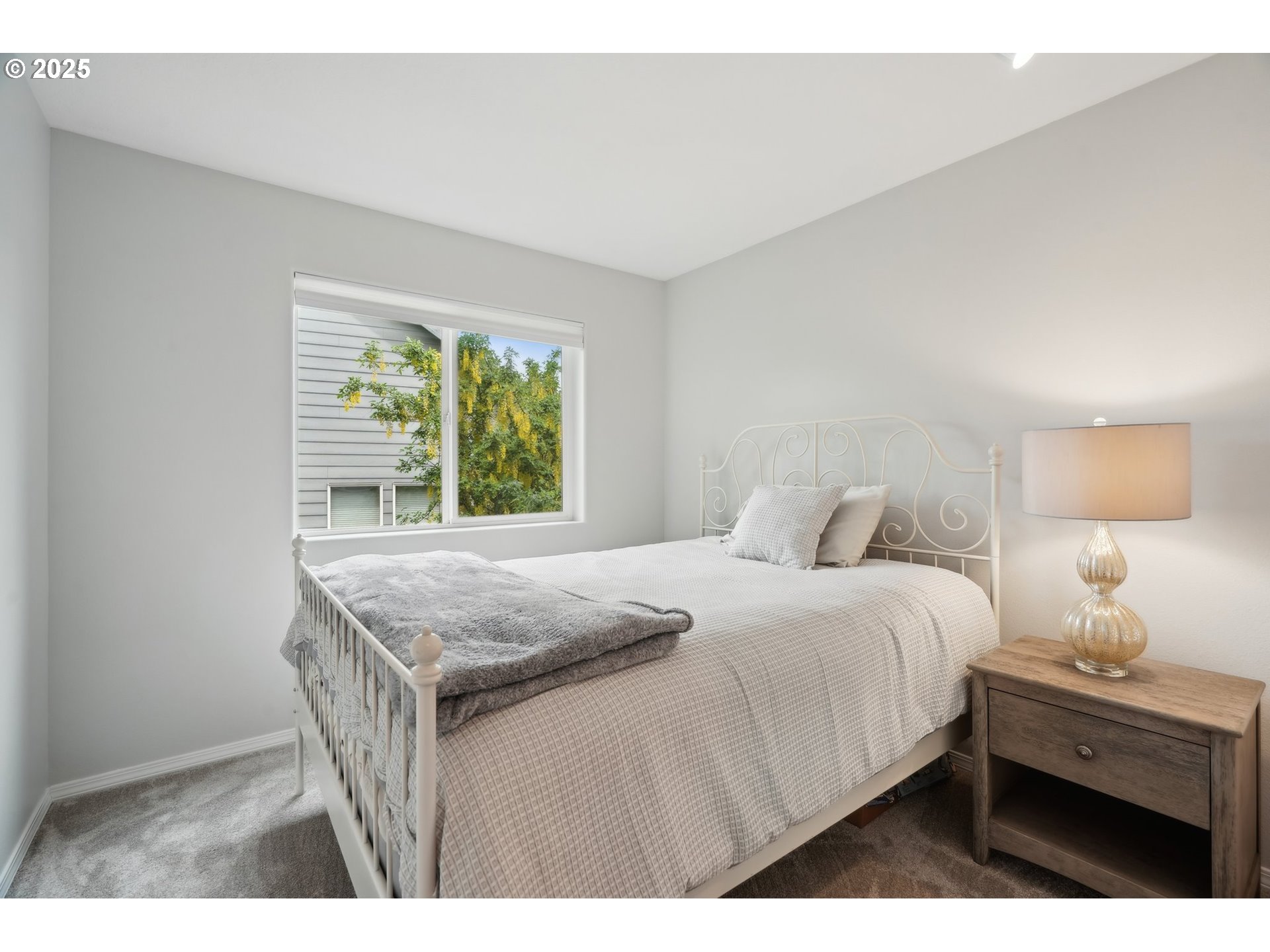 4709 Southeast Antelope Hills Gresham, OR 97080 - Photo 35 of 48 a bedroom with a bed and a window