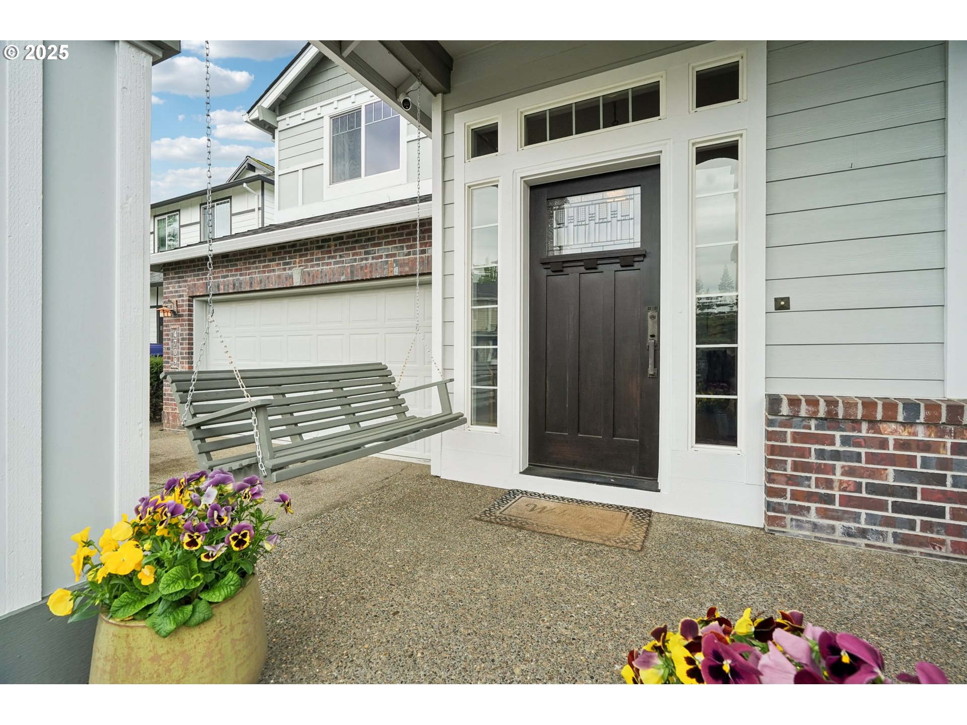 4709 Southeast Antelope Hills Gresham, OR 97080 - Photo 5 of 48 a front view of a house with a garage