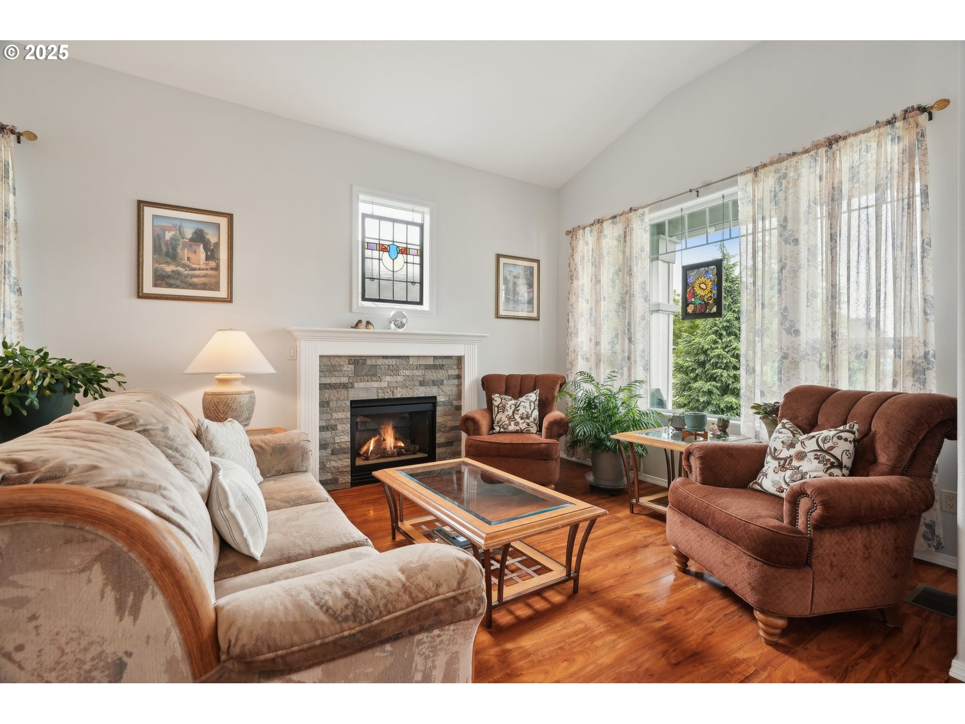 4709 Southeast Antelope Hills Gresham, OR 97080 - Photo 8 of 48 a living room with furniture and a fireplace