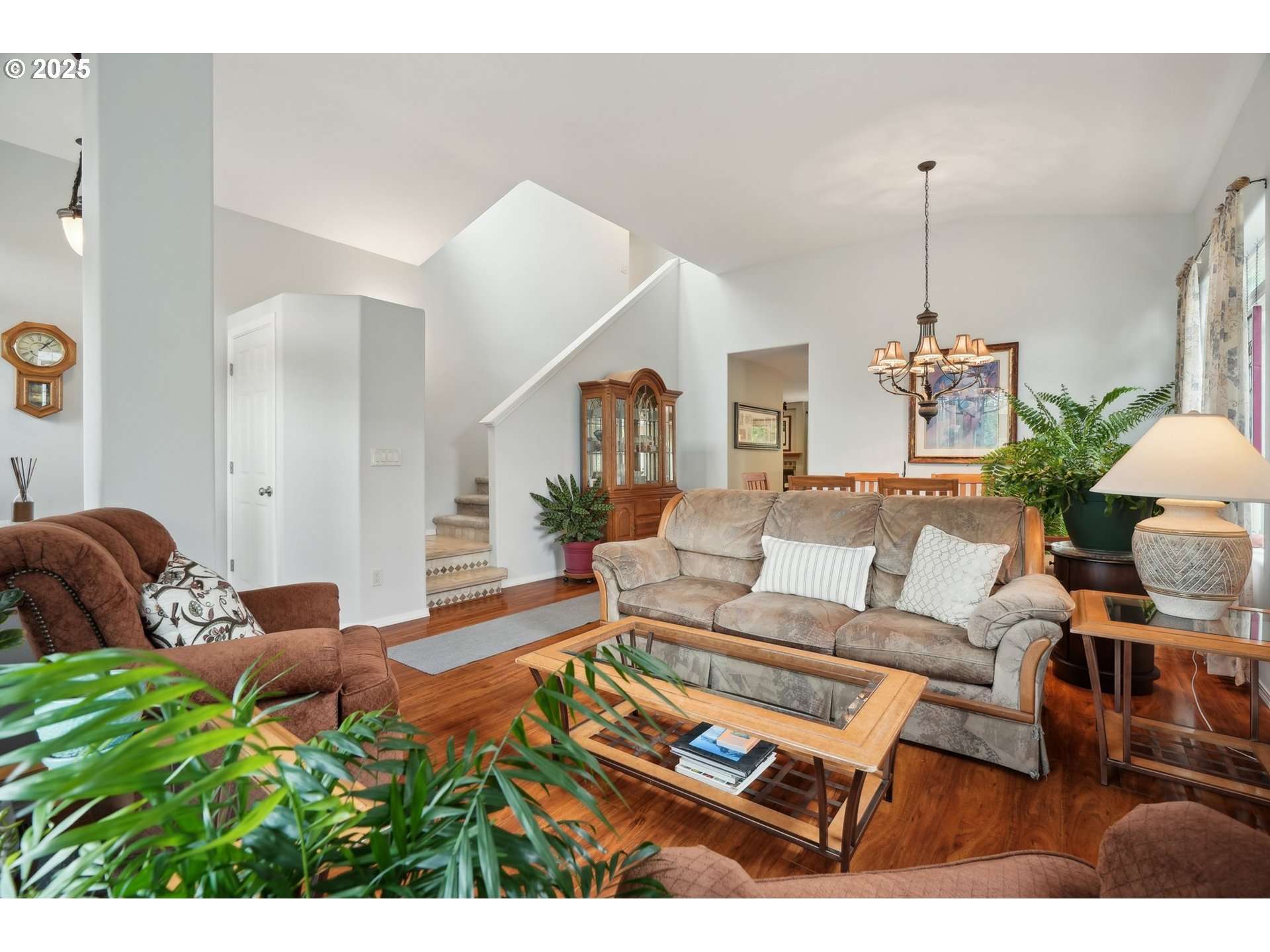 4709 Southeast Antelope Hills Gresham, OR 97080 - Photo 9 of 48 a living room with furniture and a chandelier