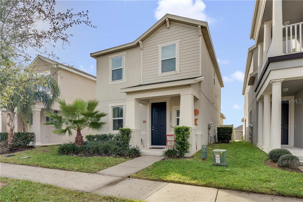 14801 Magnolia Ridge Loop Winter Garden, FL 34787 - Photo 1 of 1 a front view of a house with a yard