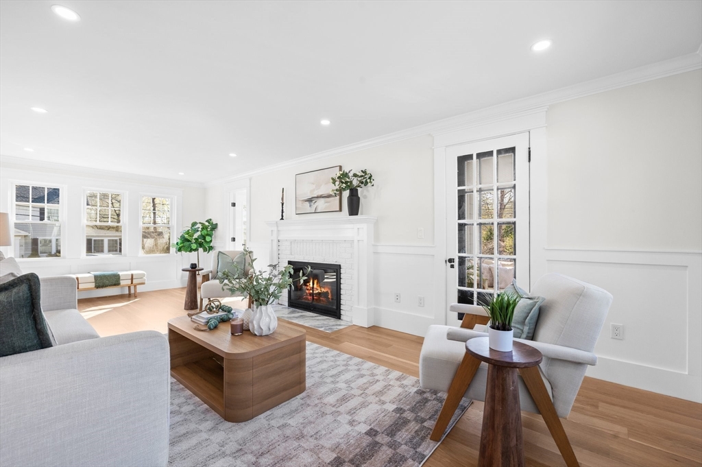 26 Holman Road Newton, MA 02466 - Photo 15 of 33 a living room with furniture and a fireplace