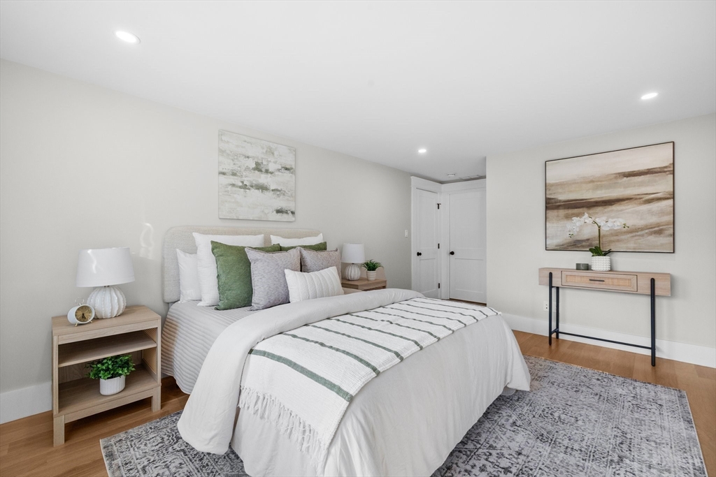 26 Holman Road Newton, MA 02466 - Photo 17 of 33 a spacious bedroom with a bed and a dresser