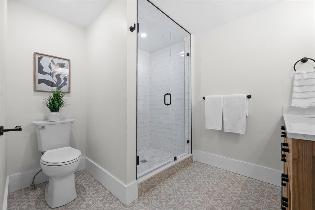 26 Holman Road Newton, MA 02466 - Photo 19 of 33 a bathroom with a toilet and a shower