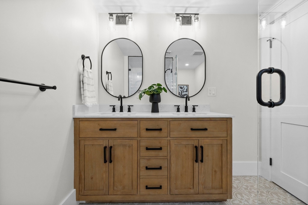 26 Holman Road Newton, MA 02466 - Photo 20 of 33 a bathroom with 2 sink and a mirror