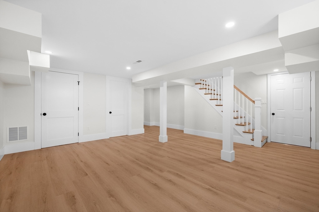 26 Holman Road Newton, MA 02466 - Photo 26 of 33 a view of empty room with wooden floor
