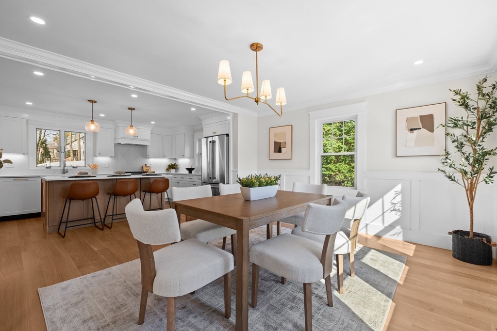 26 Holman Road Newton, MA 02466 - Photo 5 of 33 a view of a dining room with furniture and wooden floor