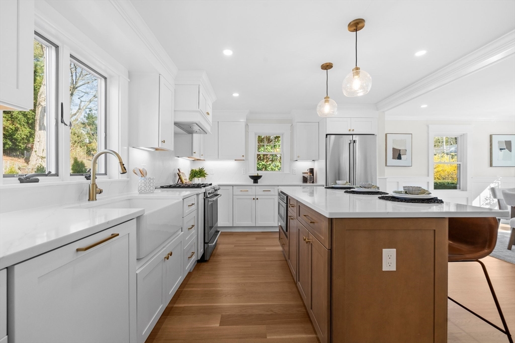 26 Holman Road Newton, MA 02466 - Photo 7 of 33 a kitchen with counter top space a sink appliances and windows