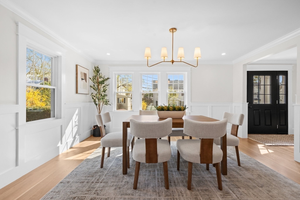 26 Holman Road Newton, MA 02466 - Photo 8 of 33 a view of a dining room with furniture and wooden floor