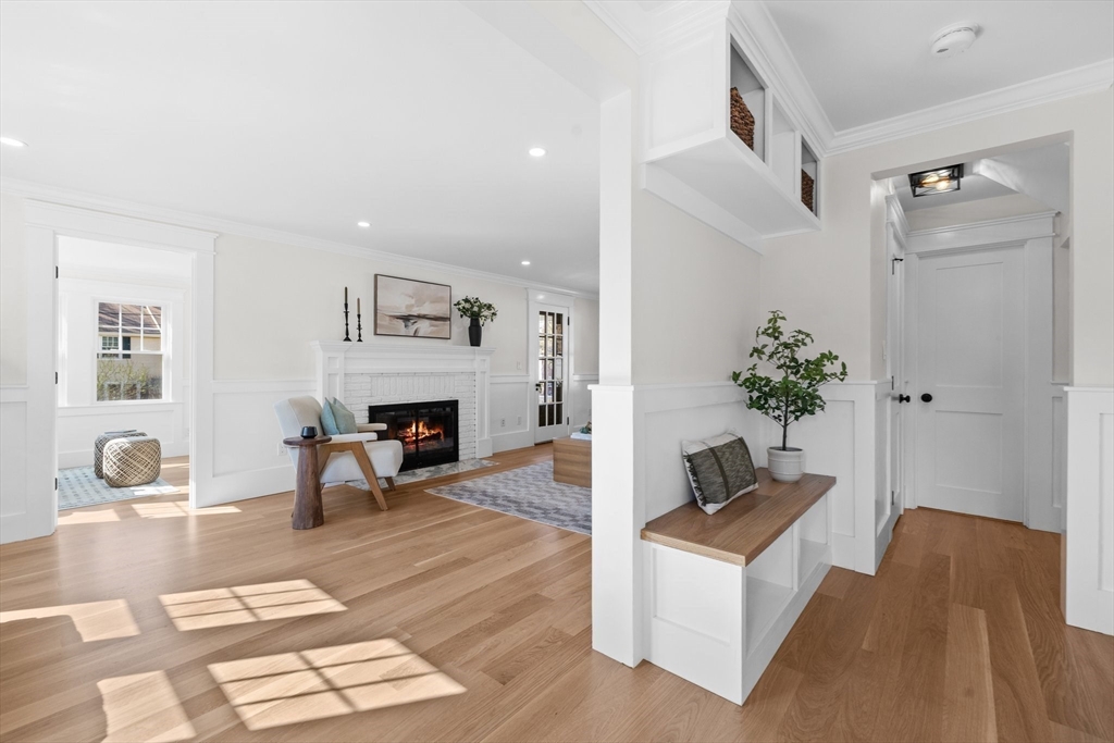 26 Holman Road Newton, MA 02466 - Photo 10 of 33 a living room with furniture and a fireplace