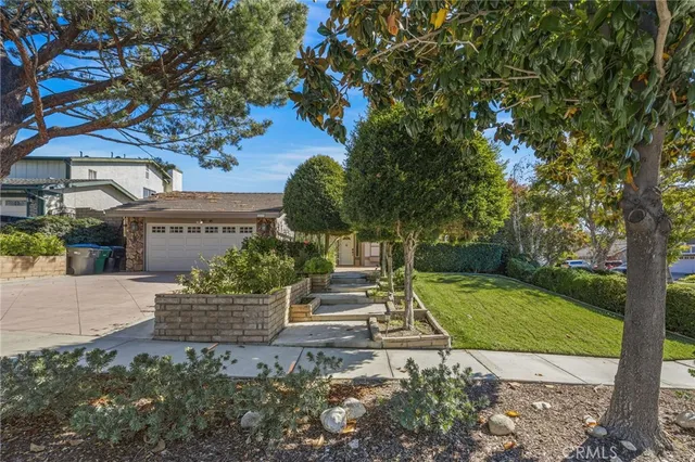 a view of a house with a garden