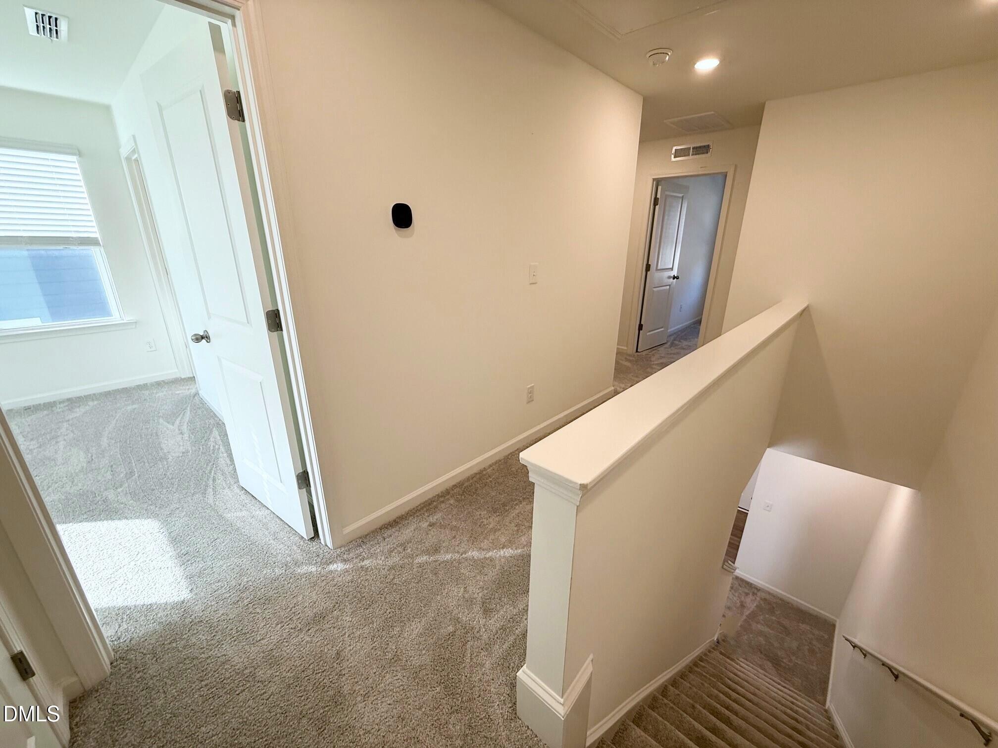 332 Hacksaw Trail Raleigh, NC 27610 - Photo 14 of 29 a view of a hallway with staircase
