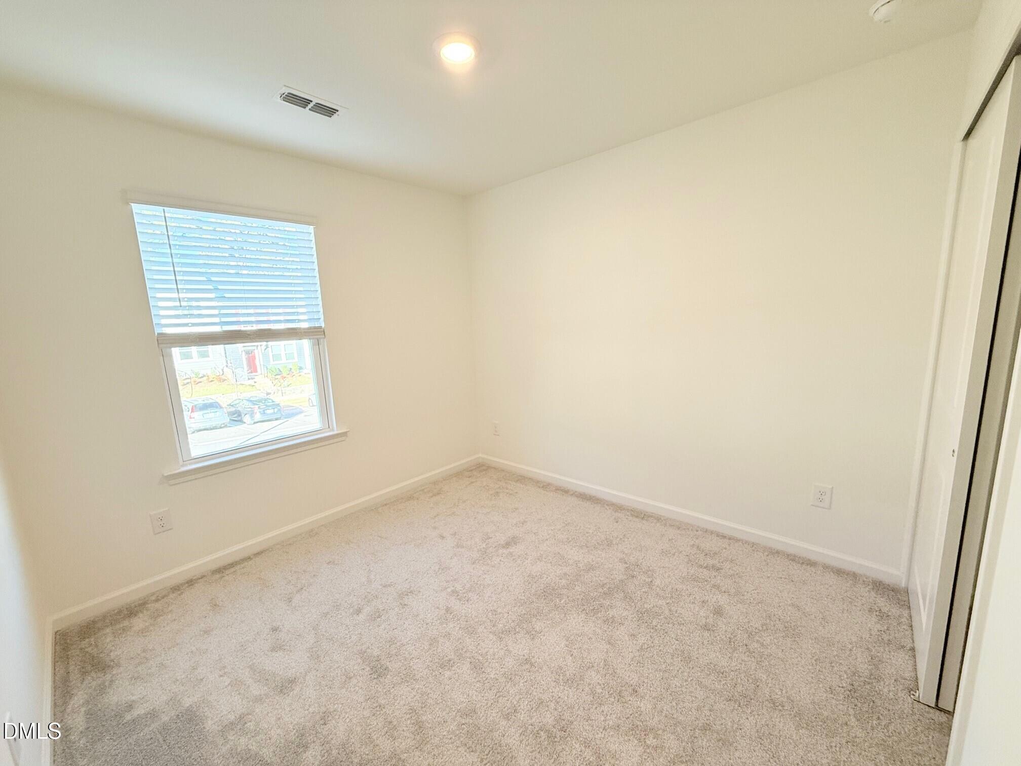 332 Hacksaw Trail Raleigh, NC 27610 - Photo 23 of 29 an empty room with a window