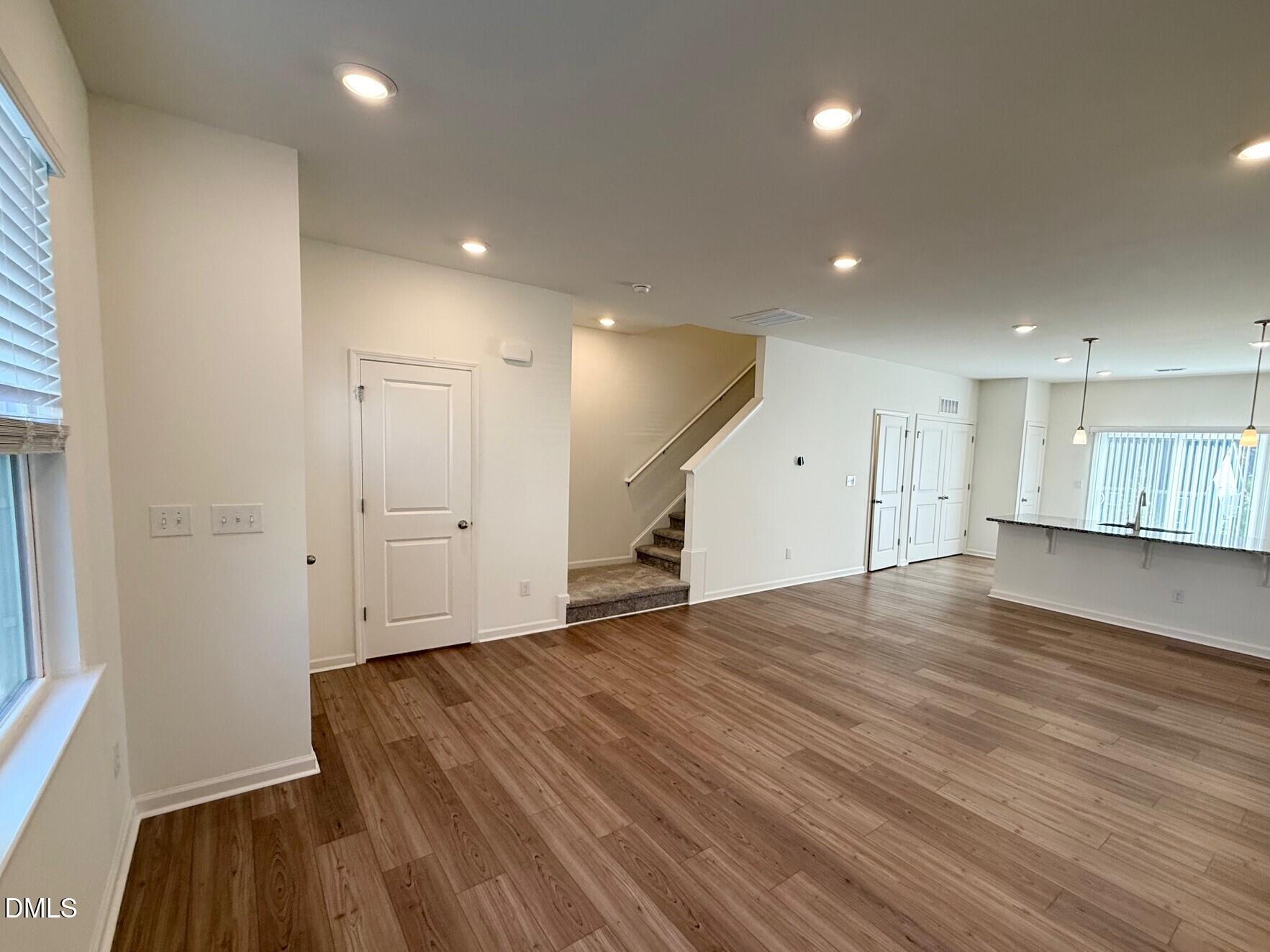 332 Hacksaw Trail Raleigh, NC 27610 - Photo 6 of 29 a view of empty room with wooden floor