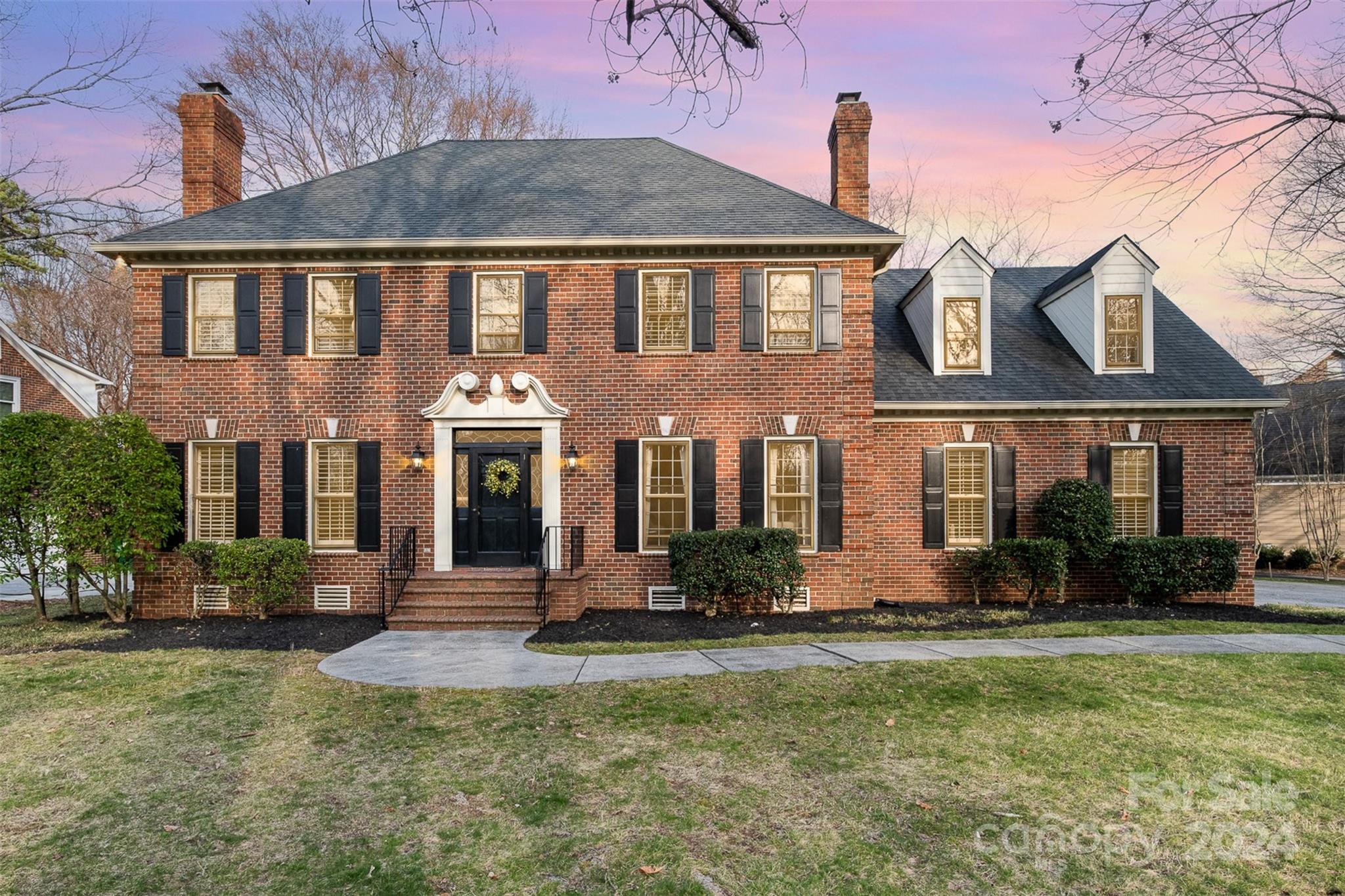 10264 Foxhall Drive Charlotte, NC 28210 - Photo 1 of 26 a front view of a house with a yard