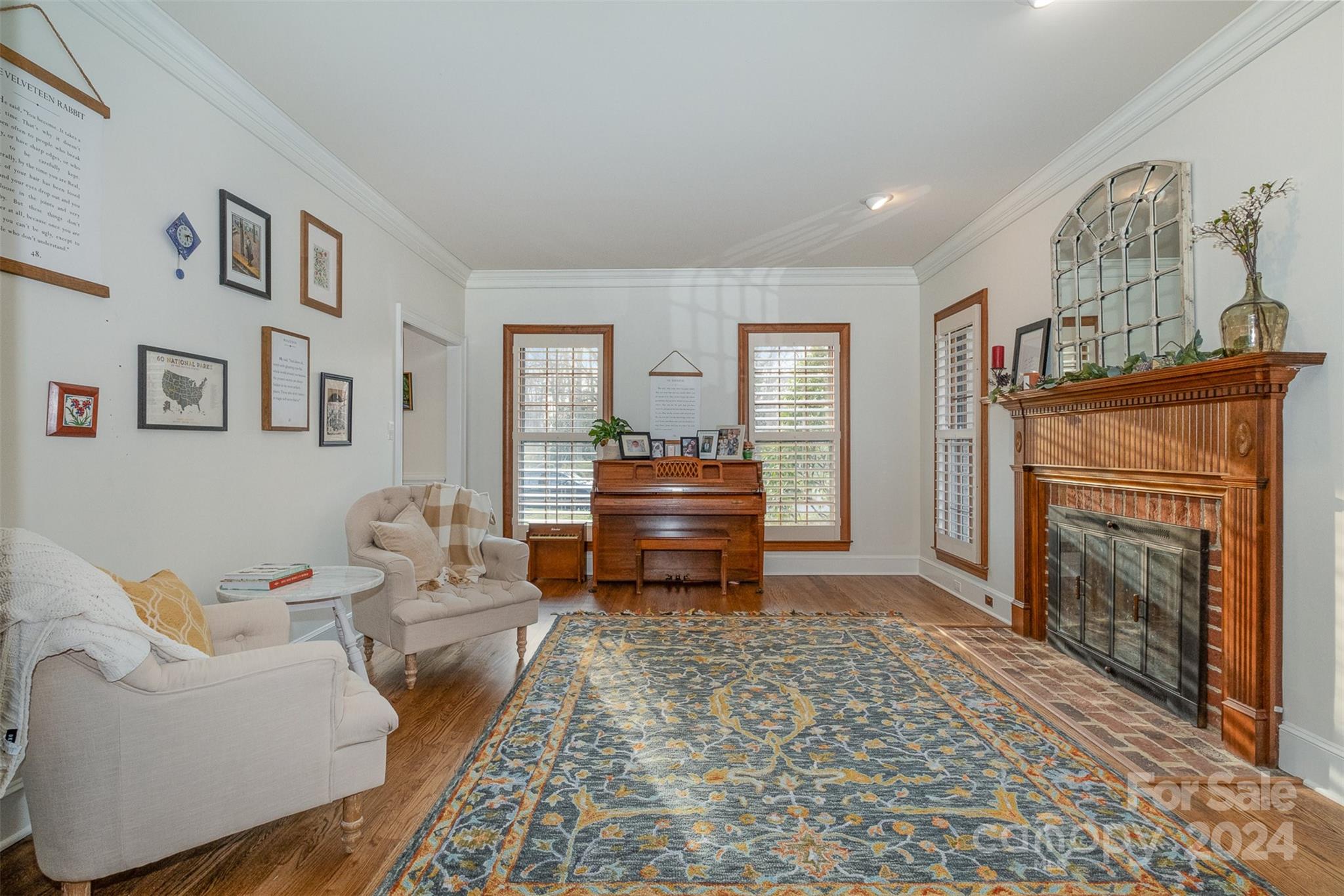 10264 Foxhall Drive Charlotte, NC 28210 - Photo 11 of 26 a living room with furniture and a fireplace
