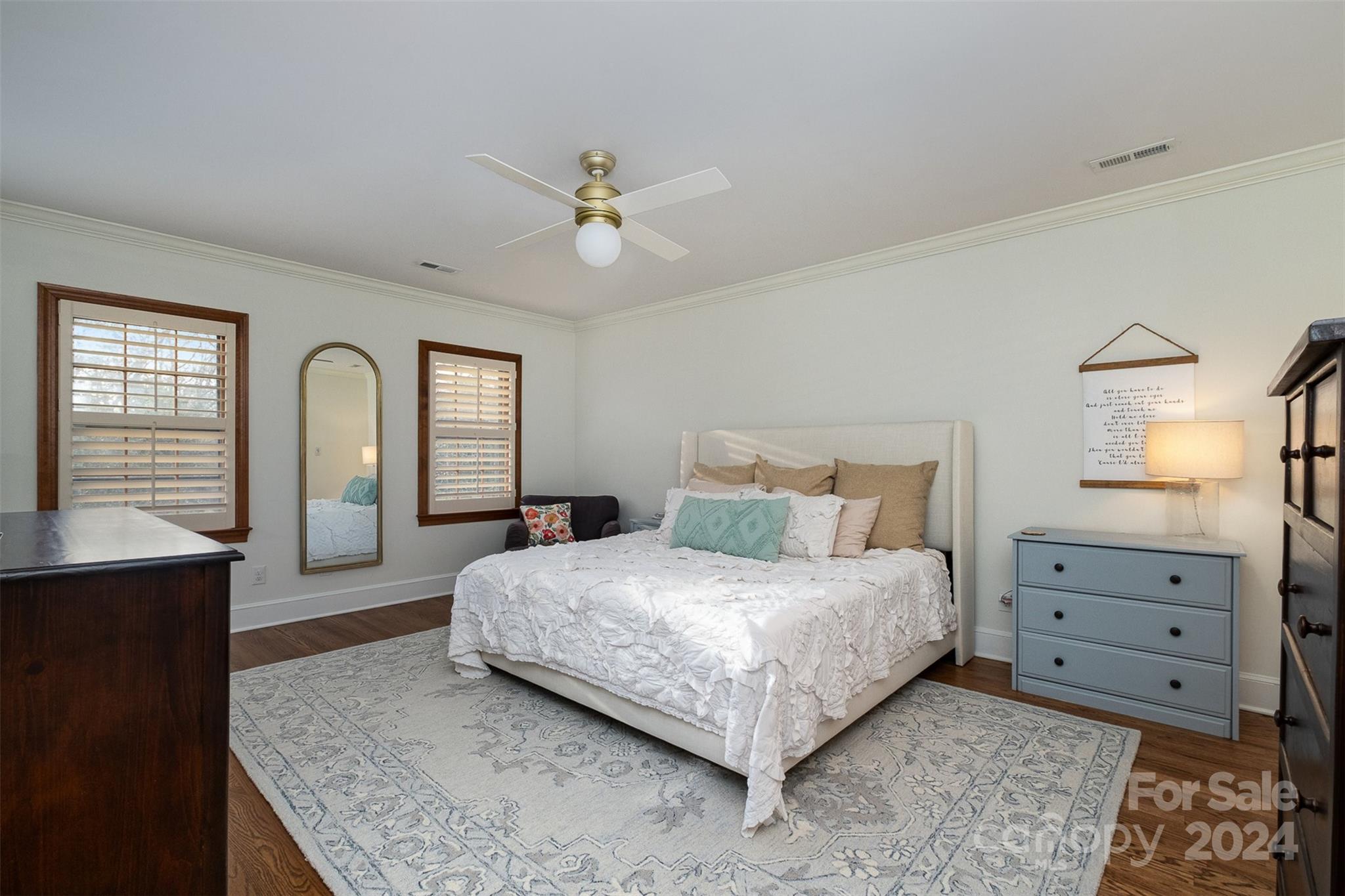 10264 Foxhall Drive Charlotte, NC 28210 - Photo 16 of 26 a bedroom with a large bed and a dresser