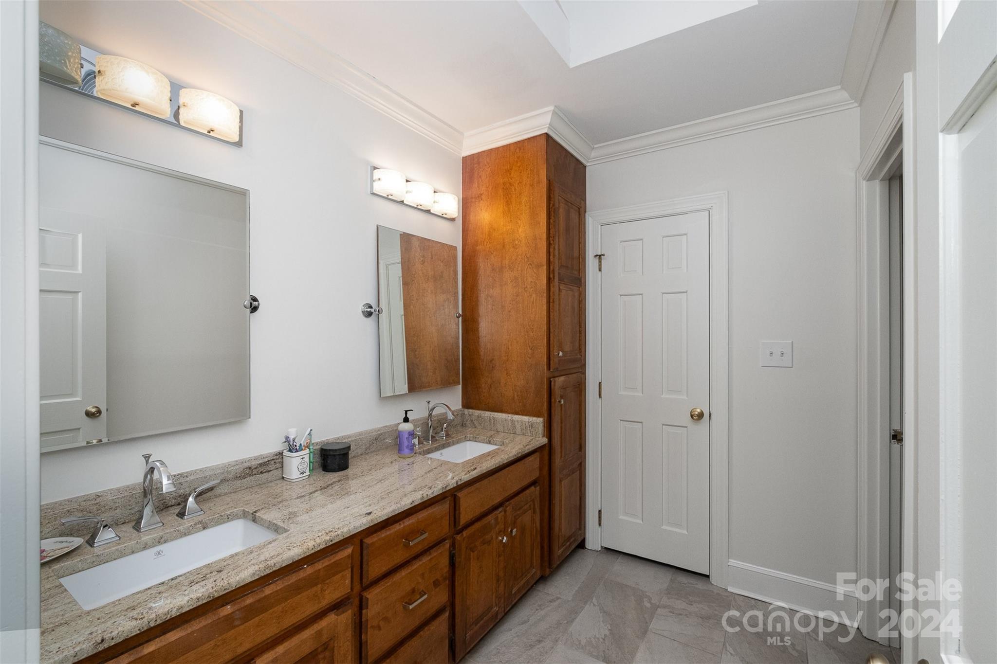 10264 Foxhall Drive Charlotte, NC 28210 - Photo 17 of 26 a bathroom with a double vanity sink mirror and double