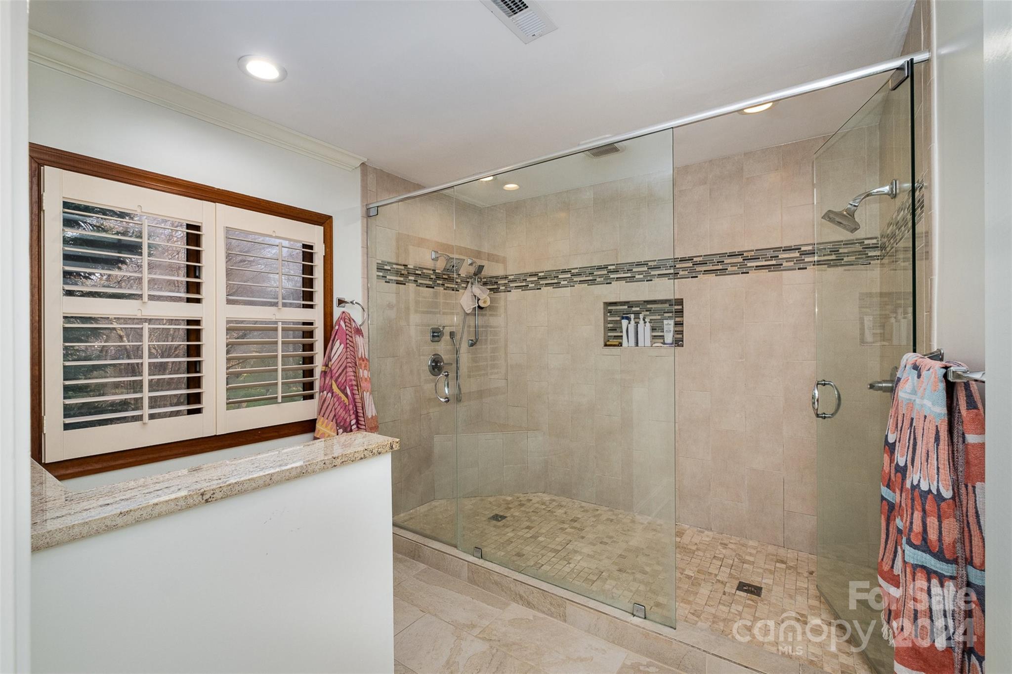 10264 Foxhall Drive Charlotte, NC 28210 - Photo 18 of 26 a bathroom with a shower and a sink