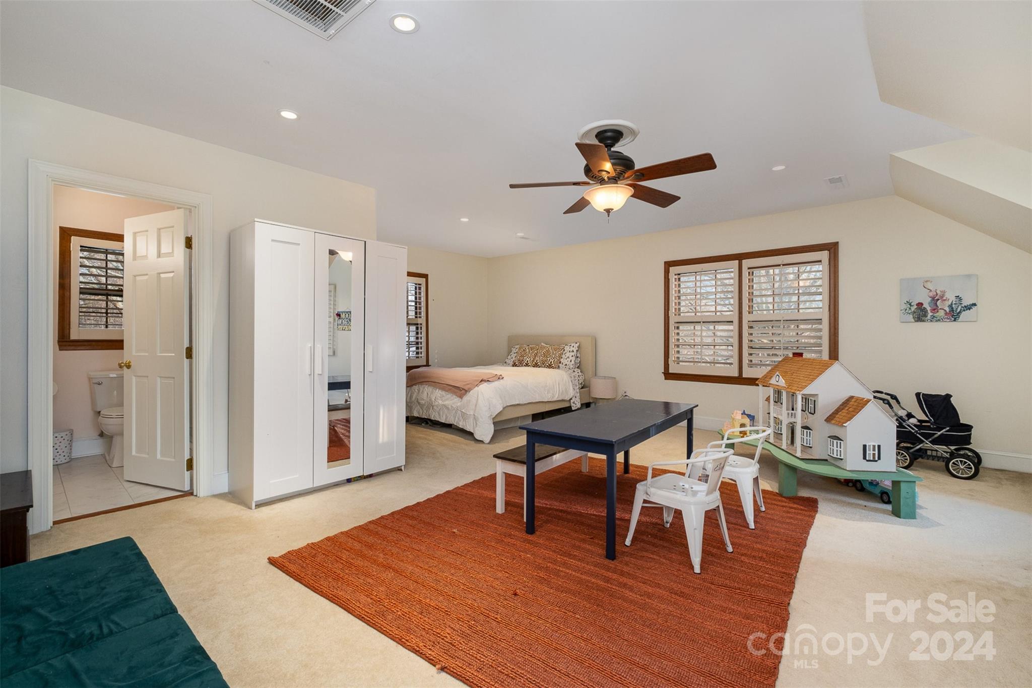 10264 Foxhall Drive Charlotte, NC 28210 - Photo 21 of 26 a living room with furniture a rug and a chandelier
