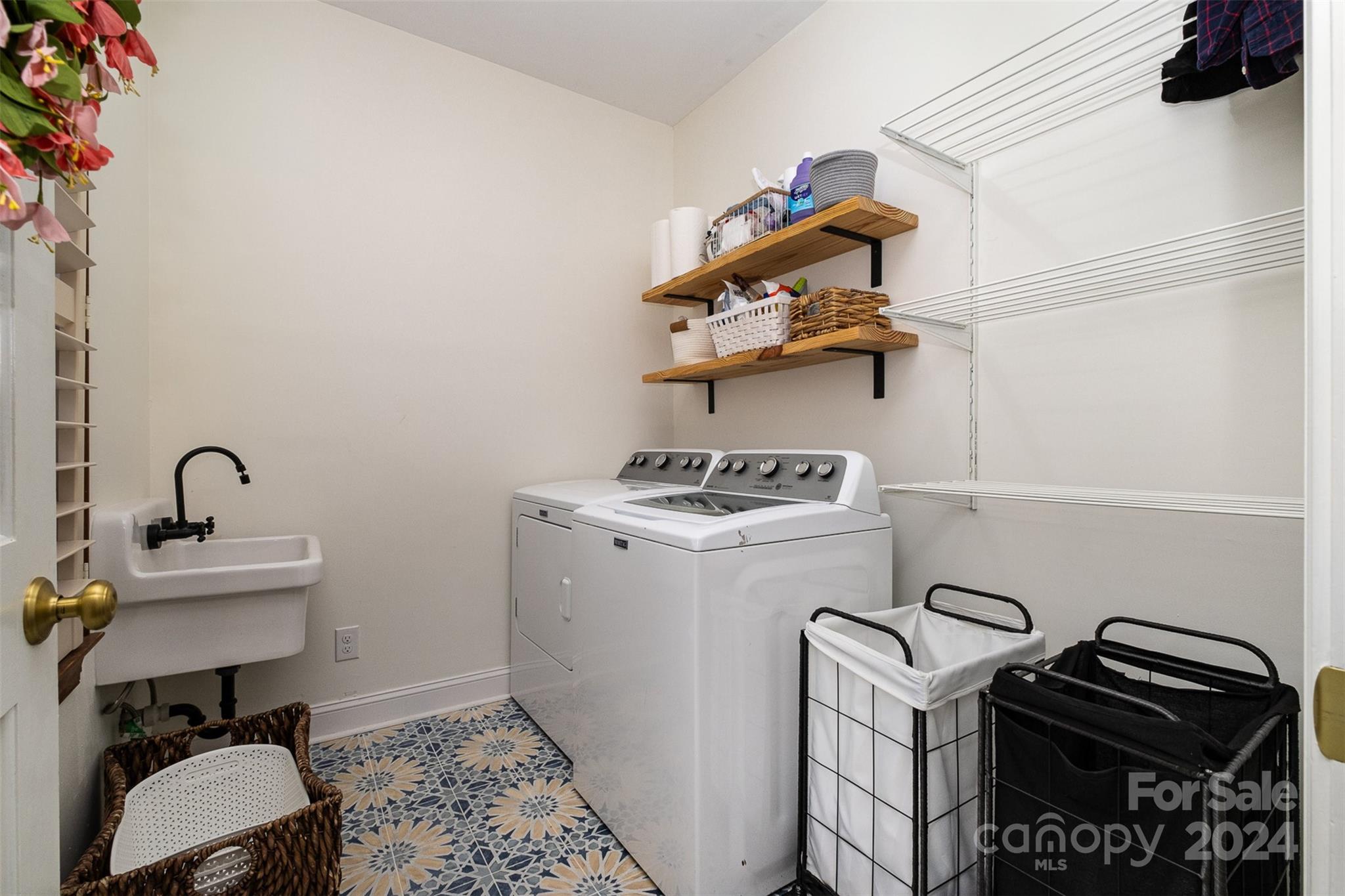 10264 Foxhall Drive Charlotte, NC 28210 - Photo 22 of 26 a view of storage and utility room with sink dryer and washer