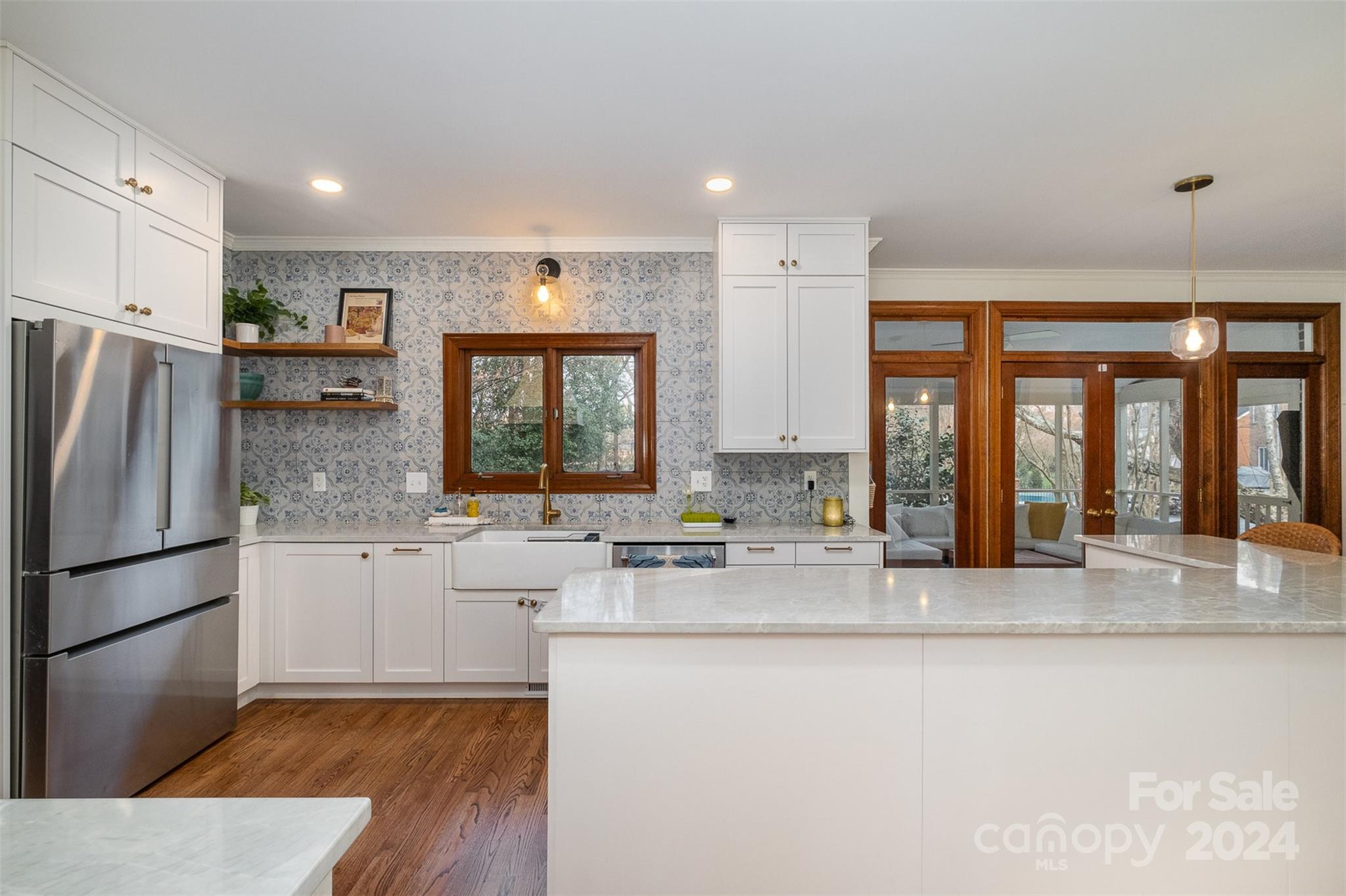 10264 Foxhall Drive Charlotte, NC 28210 - Photo 6 of 26 a kitchen with stainless steel appliances granite countertop a refrigerator a stove and a sink with large window