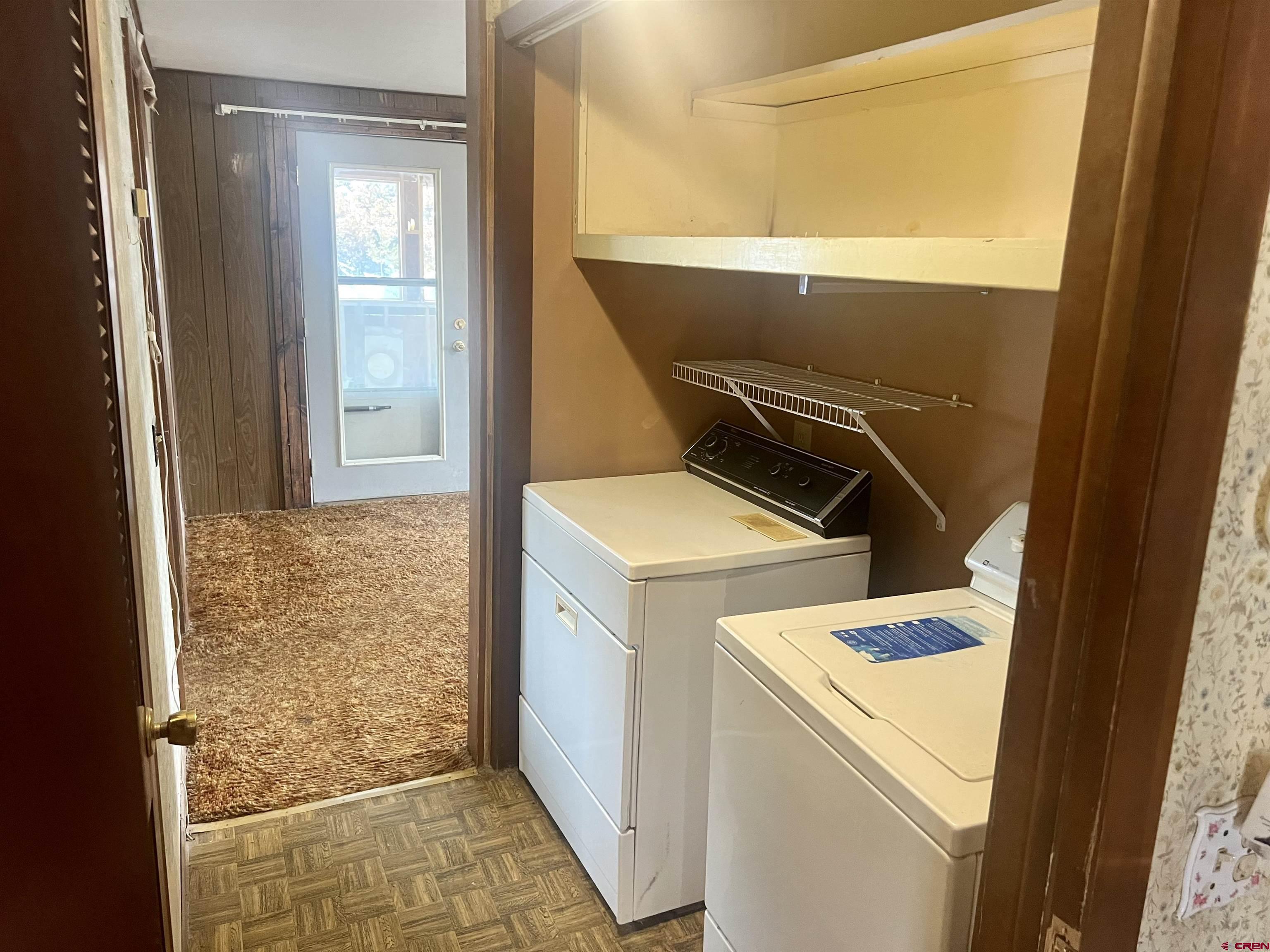 23152 Ute Trail Road Cedaredge, CO 81413 - Photo 16 of 25 a utility room with dryer and washer