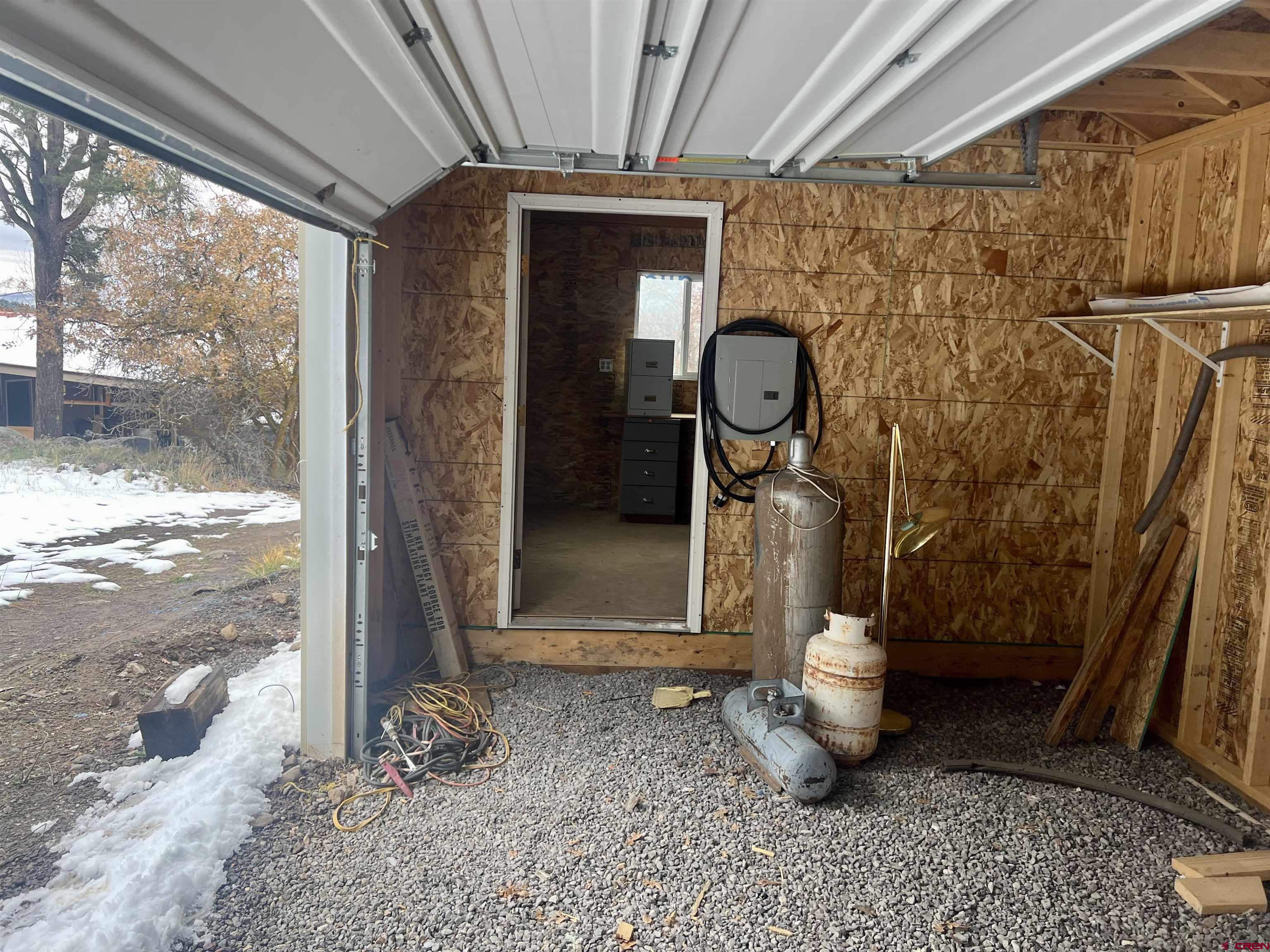 23152 Ute Trail Road Cedaredge, CO 81413 - Photo 4 of 25 a room with water heater and windows