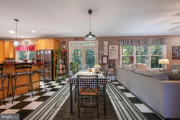 a outdoor space with lots of windows and chairs