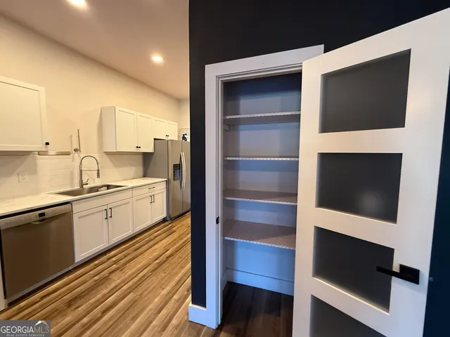 a kitchen with a sink and a microwave