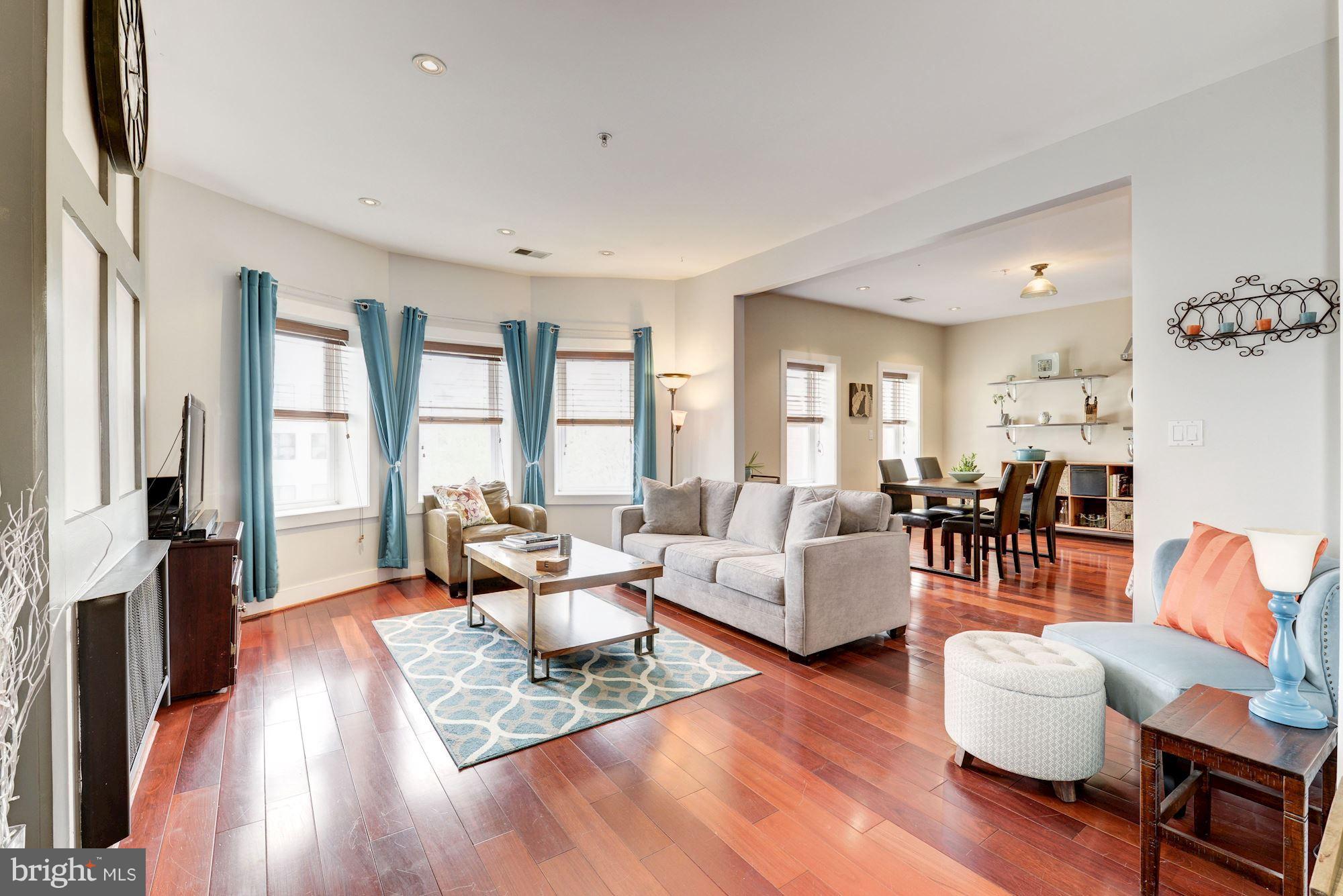 Sunny living room flows to dining/kitchen area