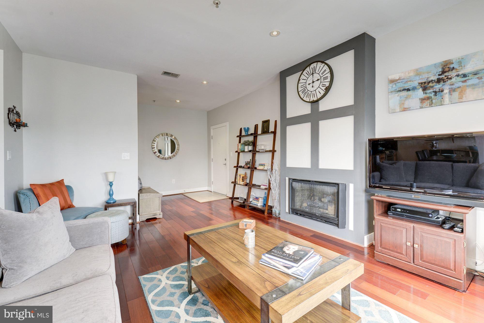1309 Park Road Northwest, Unit 301 Washington, DC 20010 - Photo 3 of 23 Inviting living room with gas fireplace