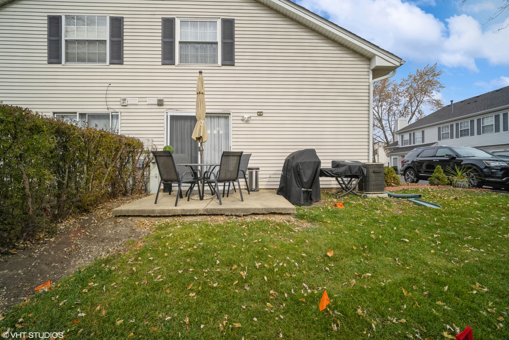 223 Butternut Lane Streamwood, IL 60107 - Photo 11 of 11 a front view of house with a garden and patio
