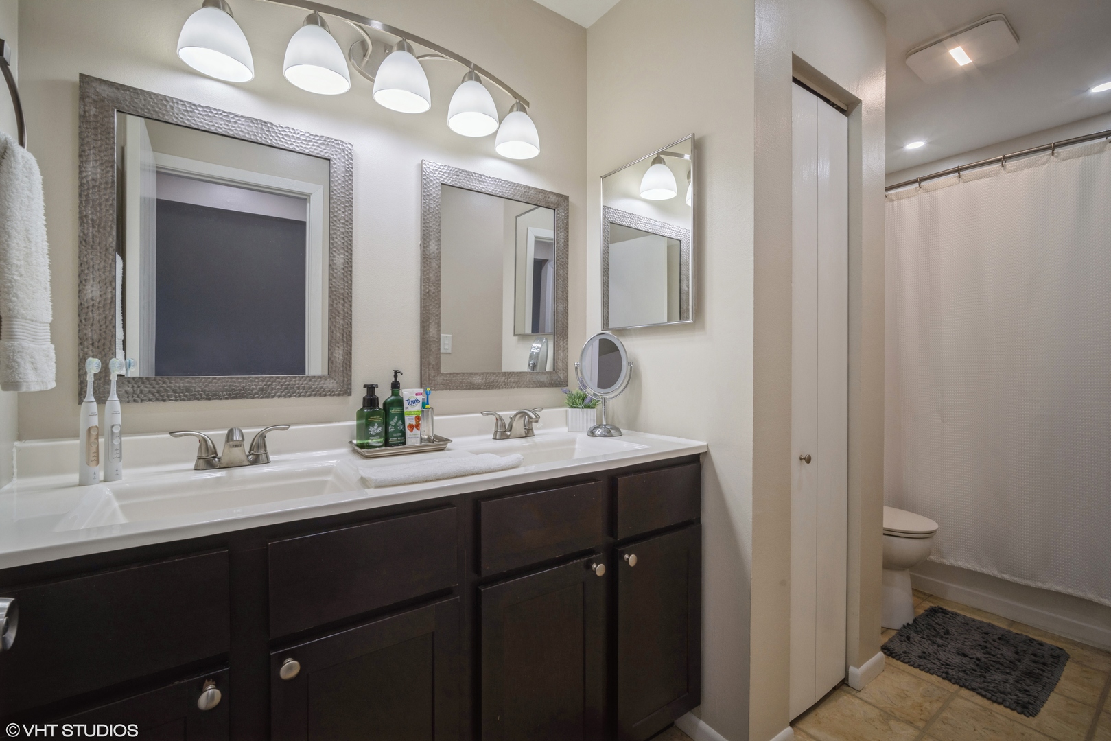 223 Butternut Lane Streamwood, IL 60107 - Photo 6 of 11 a bathroom with a double vanity sink and a mirror