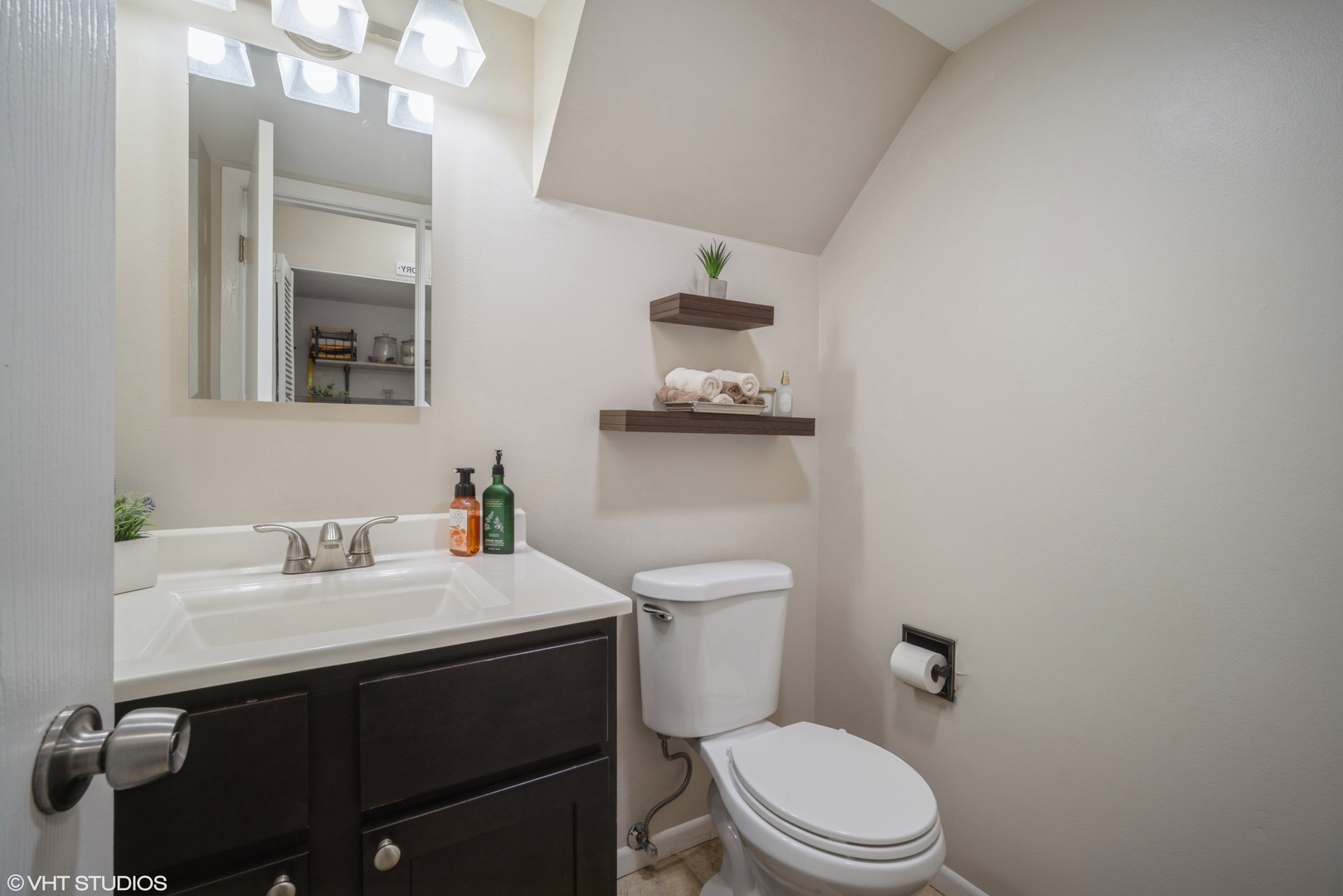 223 Butternut Lane Streamwood, IL 60107 - Photo 9 of 11 a bathroom with a sink vanity mirror and toilet
