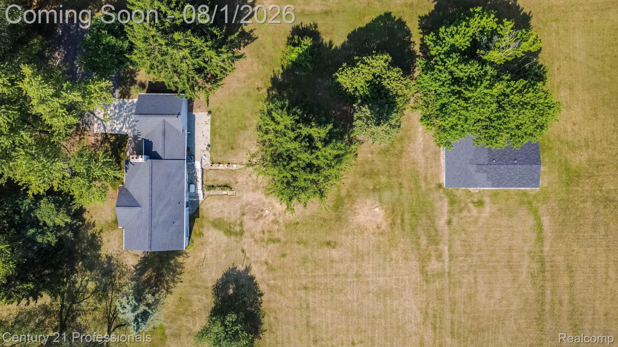 1365 East Buell Road Rochester, MI 48306 - Photo 53 of 56 Expansive property featuring a main residence with a dark shingle roof and a separate auxiliary building