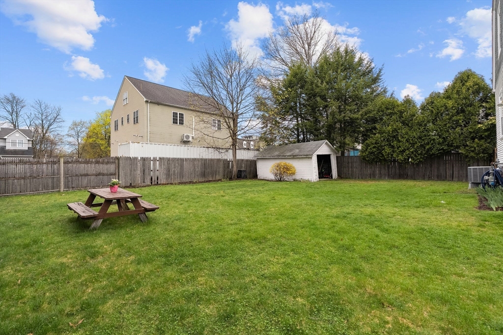 11 Draper Road Framingham, MA 01702 - Photo 22 of 23 a view of a house with backyard and a tree