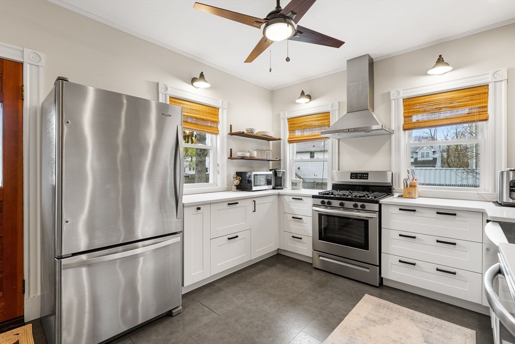11 Draper Road Framingham, MA 01702 - Photo 5 of 23 a kitchen with stainless steel appliances a refrigerator sink and cabinets