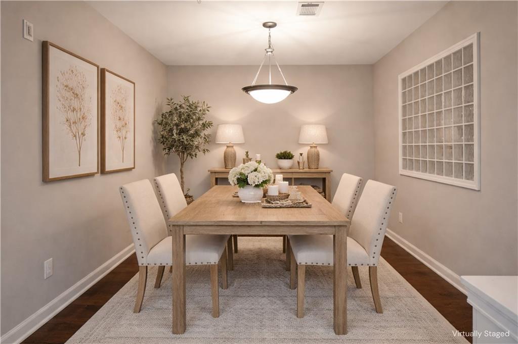10 Perimeter Summit Boulevard, Unit 4139 Atlanta, GA 30319 - Photo 3 of 15 a view of a dining room with furniture and wooden floor