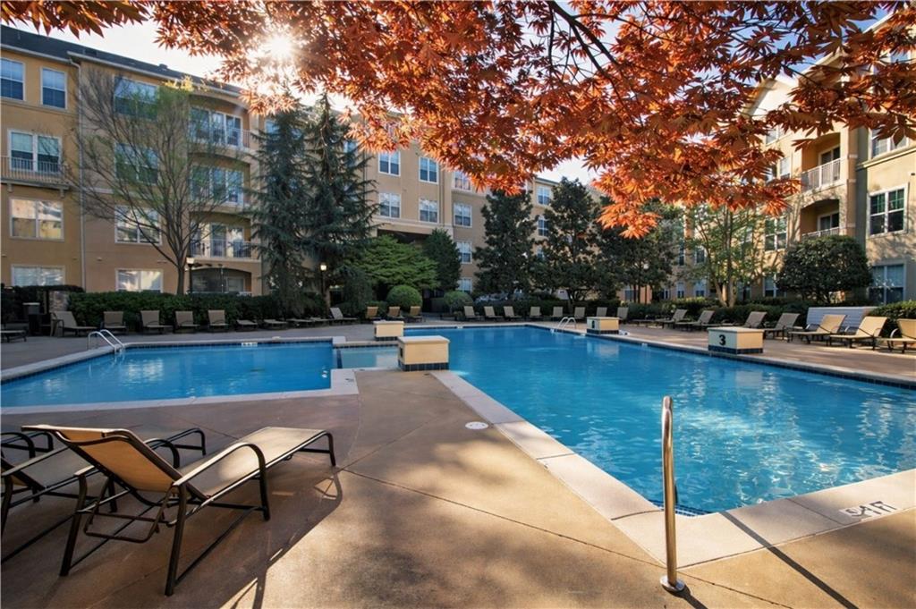 10 Perimeter Summit Boulevard, Unit 4139 Atlanta, GA 30319 - Photo 10 of 15 a view of a swimming pool with lounge chair