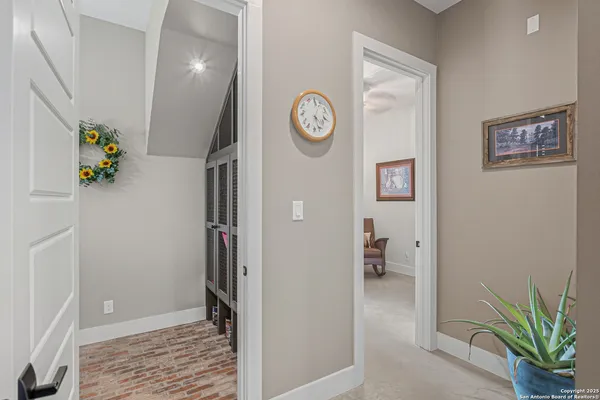 a view of an entryway with wooden floor