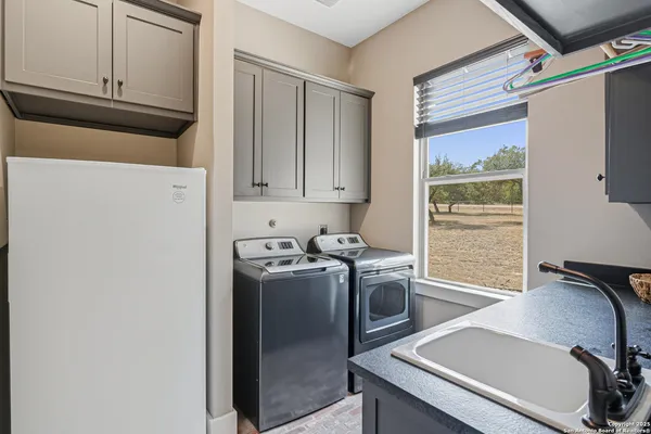 a view of a kitchen with washer and dryer
